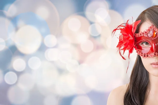 Vrouw in een carnaval masker — Stockfoto