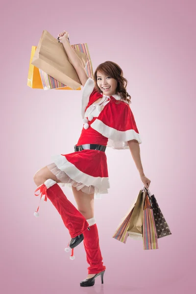 Asian Christmas girl hold shopping bags — Stock Photo, Image