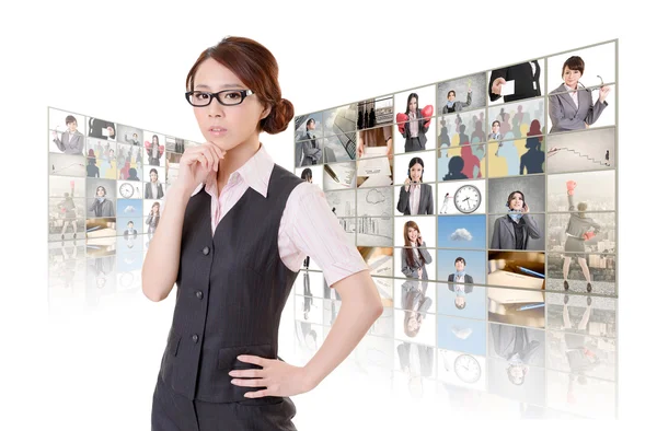 Woman standing in front of TV — Stock Photo, Image