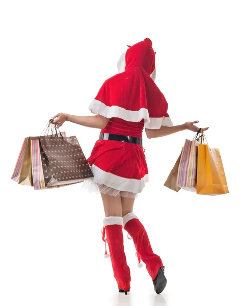 Natal menina segurando sacos de compras — Fotografia de Stock