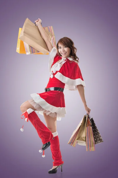 Asian Christmas girl hold shopping bags — Stock Photo, Image