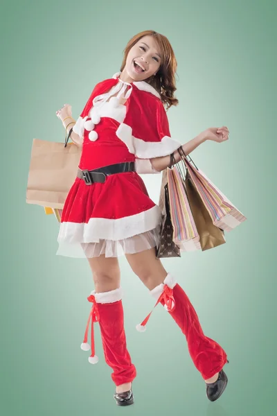 Asian Christmas girl hold shopping bags — Stock Photo, Image