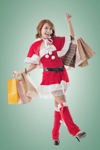 Asian Christmas girl hold shopping bags — Stock Photo, Image