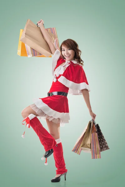 Asian Christmas girl hold shopping bags Stock Image