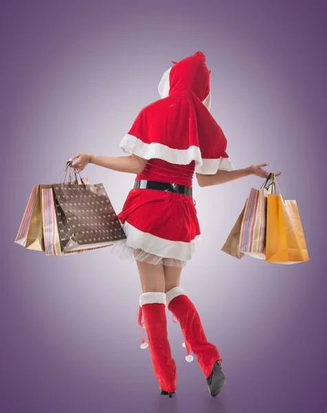 Christmas girl holding shopping bags — Stock Photo, Image