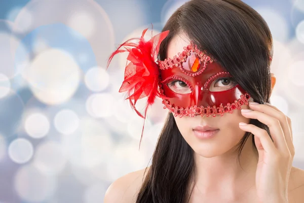 Woman in a carnival mask — Stock Photo, Image