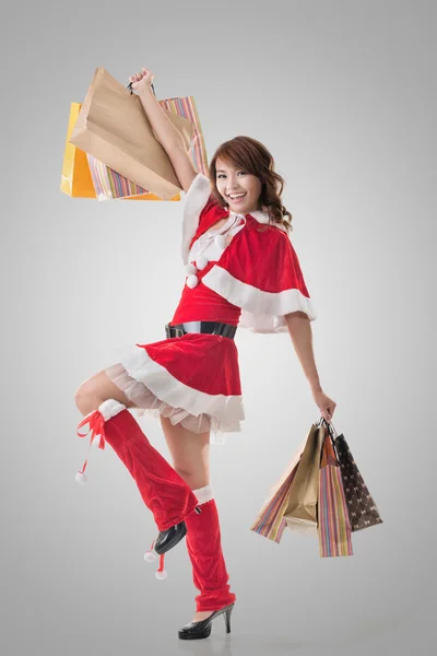Asian Christmas girl hold shopping bags Stock Picture