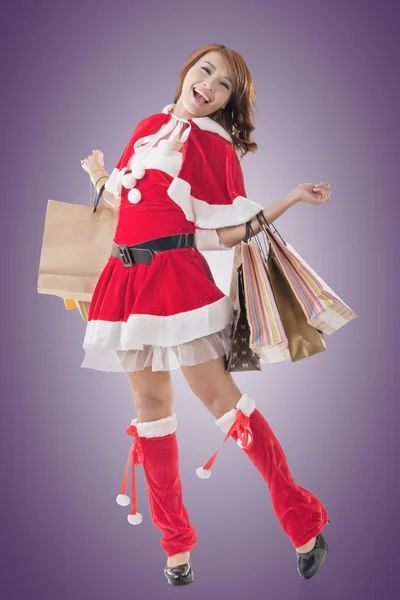 Asian Christmas girl hold shopping bags — Stock Photo, Image