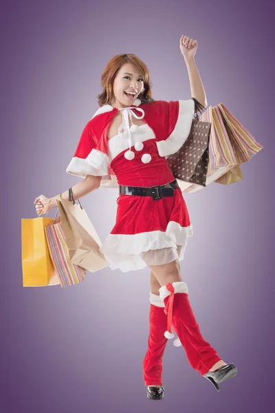 Asian Christmas girl hold shopping bags — Stock Photo, Image