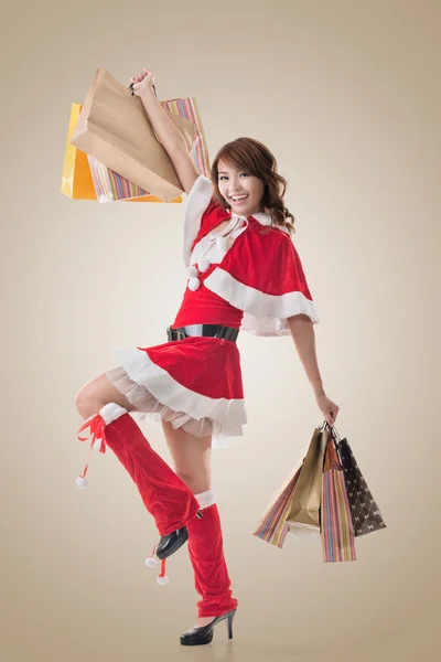 Asian Christmas girl hold shopping bags Stock Photo