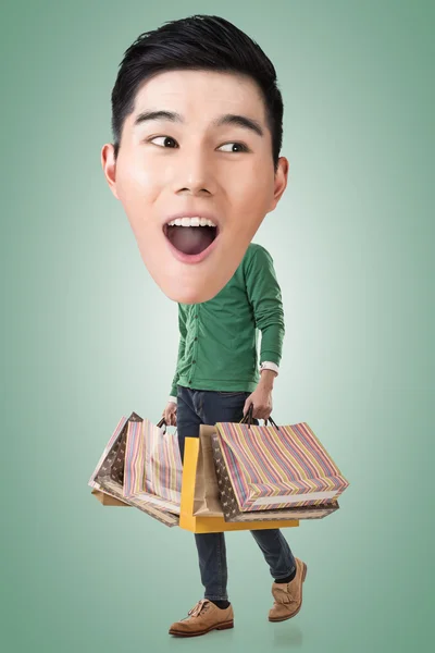 Funny shopping Asian guy — Stock Photo, Image