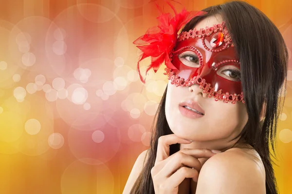 Beautiful woman in a carnival mask — Stock Photo, Image