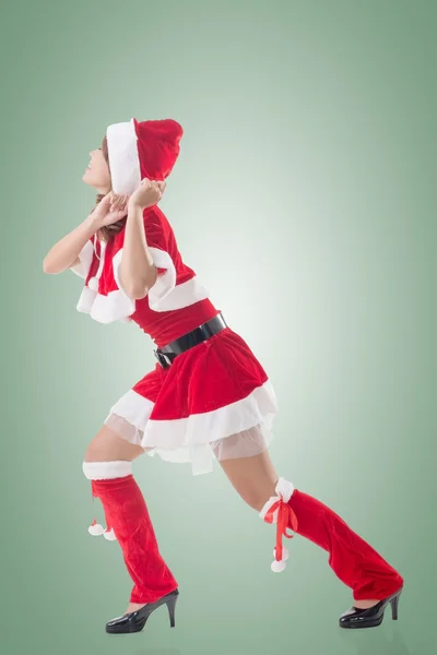 Christmas girl pull something — Stock Photo, Image