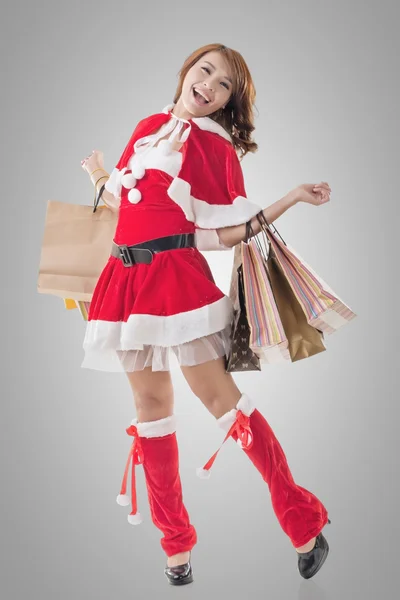 Asian Christmas girl hold shopping bags — Stock Photo, Image