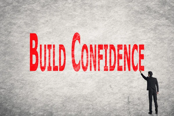 Write words on wall, Build Confidence — Stock Photo, Image