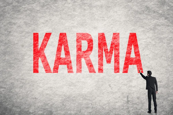 Text na zdi, Karma — Stock fotografie