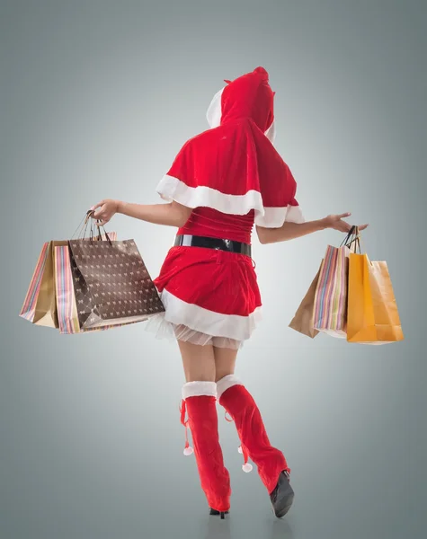 Christmas girl holding shopping bags — Stock Photo, Image