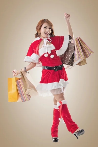 Aziatische Kerstmis meisje greep shopping tassen — Stockfoto