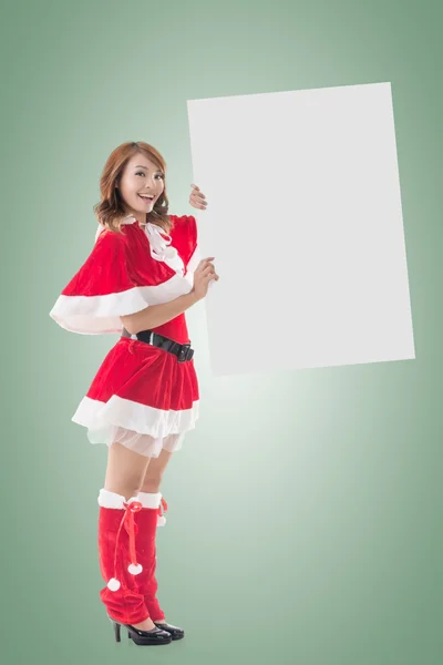 Christmas girl holding a blank board — Stock Photo, Image