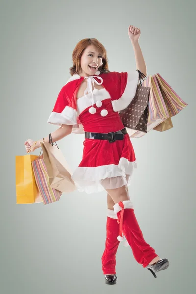 Asian Christmas girl hold shopping bags — Stock Photo, Image