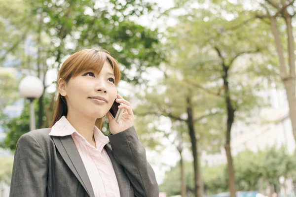 Attractive Asian business woman talk on phone — Stock Photo, Image