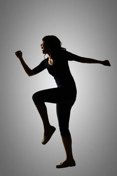 Silhueta de jovem mulher asiática — Fotografia de Stock