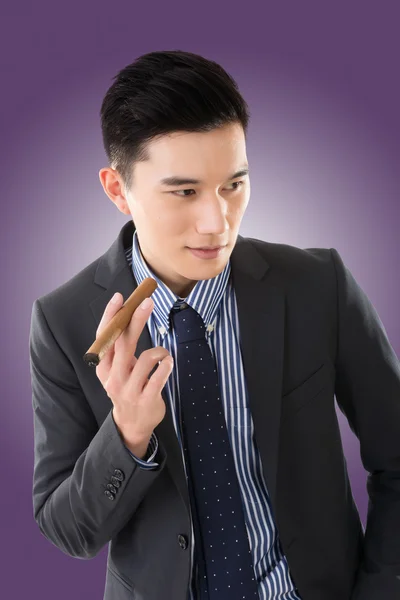 Businessman holding a cigar — Stock Photo, Image