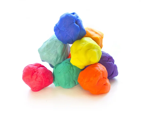 Modelling clay balls on white — Stock Photo, Image