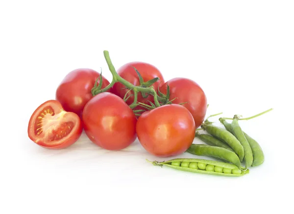 Stack of tomatoes  and peas — Stock Photo, Image