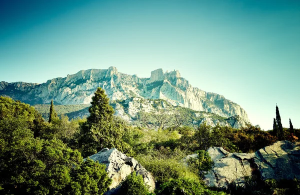 Mountains and sea at sunset — Stock Photo, Image