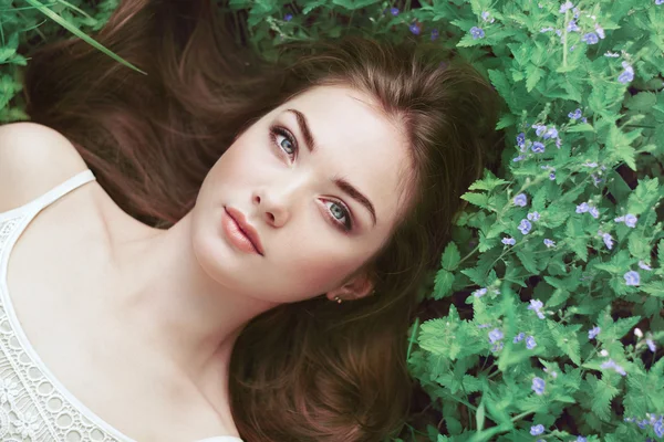 Portrait of a beautiful young woman in summer garden — Stock Image Portrait of a beautiful young woman in summer garden Royalty Free Stock Photos