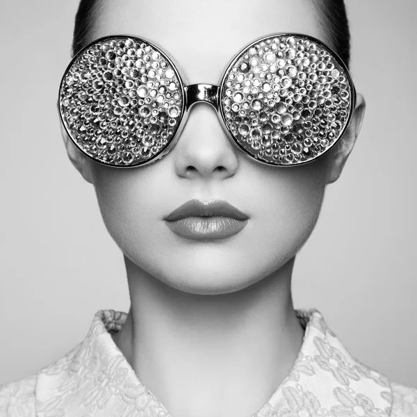 Portrait of beautiful young woman with colored glasses — Stock Photo, Image