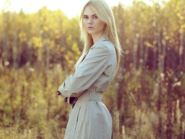 Portrait of young beautiful woman in autumn cloak — Stock Photo, Image