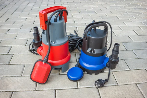 Two Household Submersible Pump Plastic Housings Stone Floor Courtyard — Stock Photo, Image