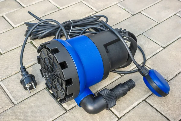 New Submersible Electric Pump Blue Plastic Housing Stone Floor — Stock Photo, Image