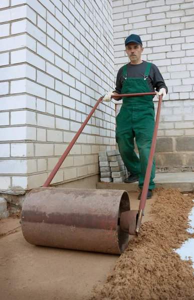 Soil compaction before creating sidewalk — Stock Photo, Image