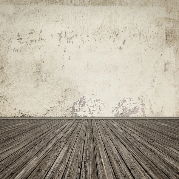 Деревянный пол с царапанной стеной — стоковое фото