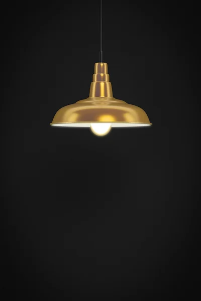 Gouden lamp voor een donkere muur — Stockfoto