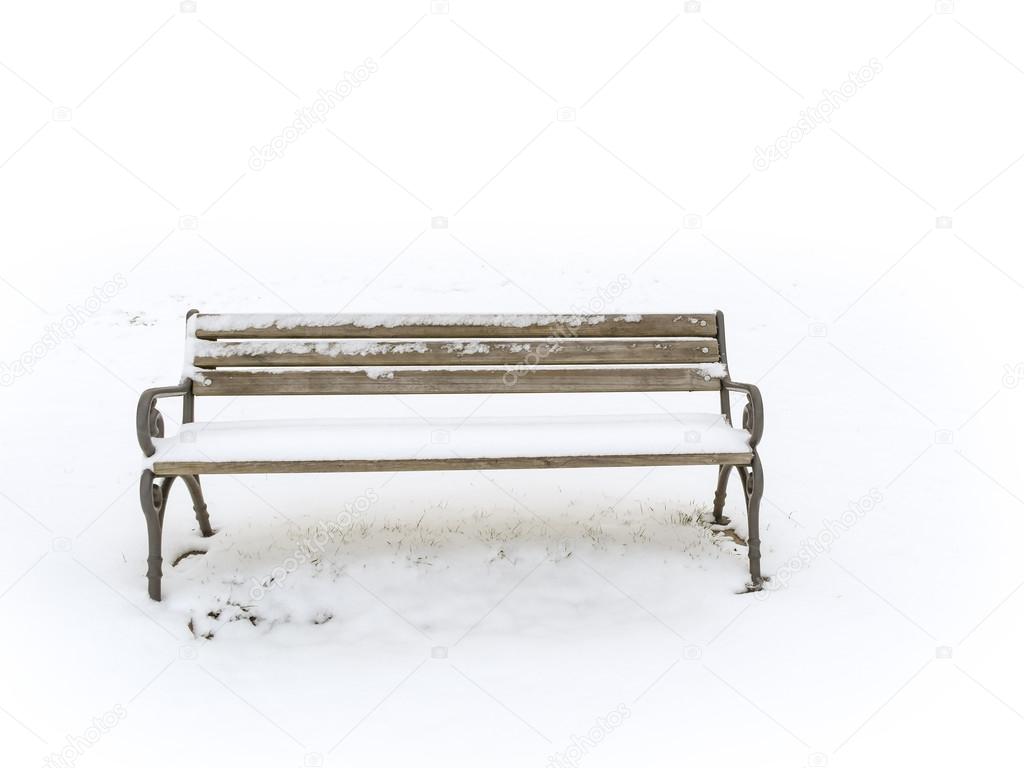 Bench in a snowy winter senery