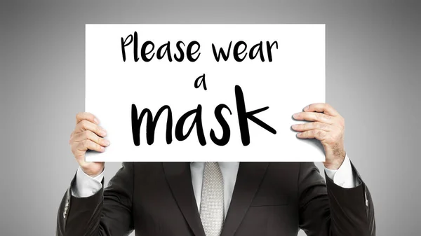 Obchodník Který Před Obličejem Papír Vzkazem Prosím Vezměte Masku — Stock fotografie