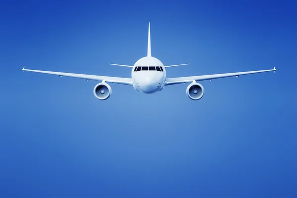 Самолет в ярко-голубом небе — стоковое фото