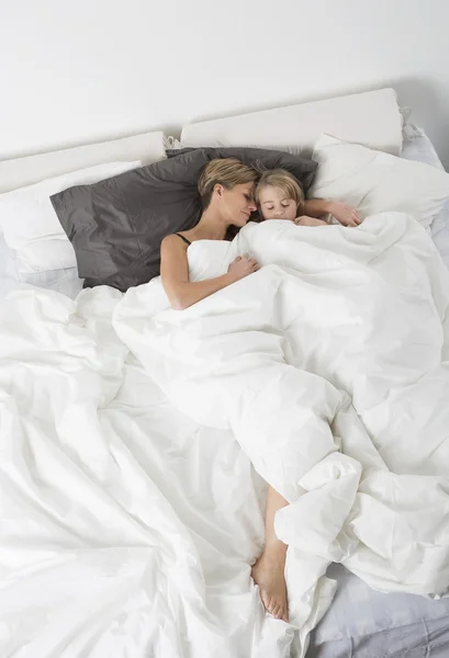 Mother and daughter sleeping from high angle view — Stock Photo, Image