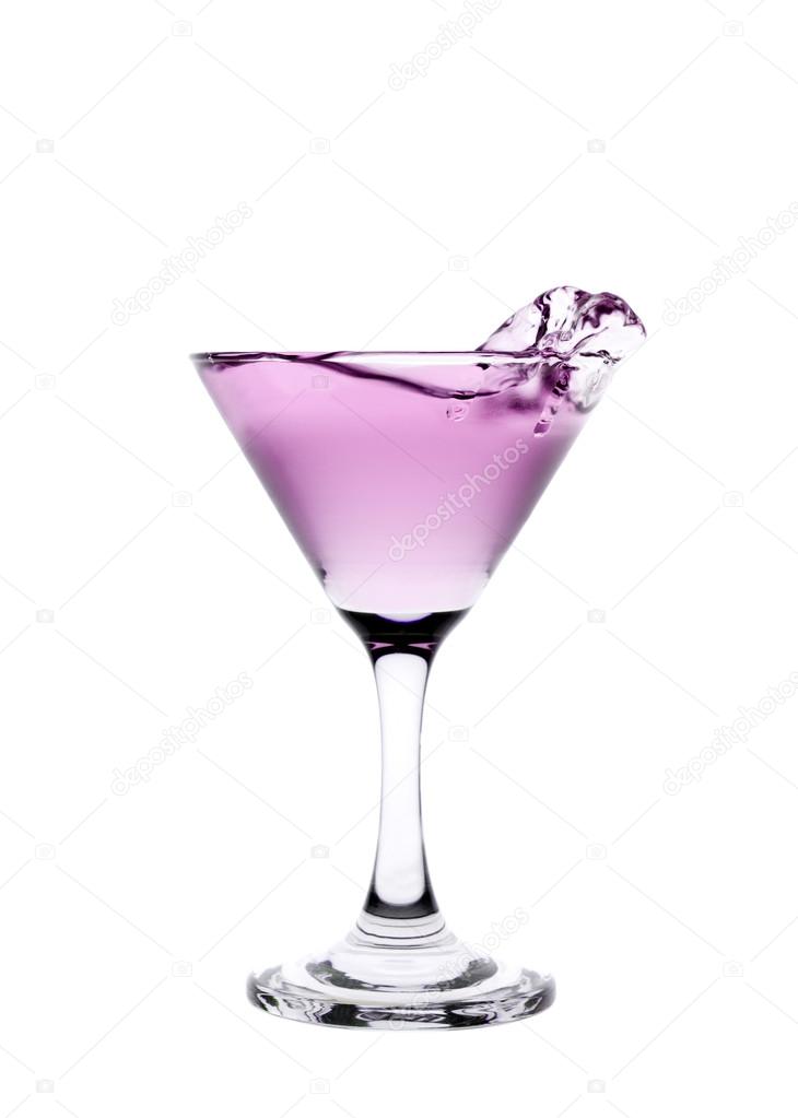 Pink liquid splashing in a martini glass isolated on white backg