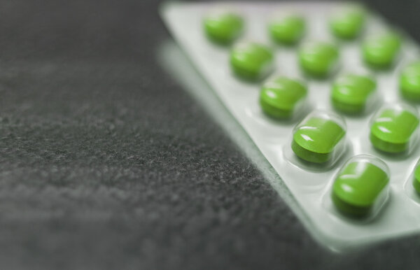 Волдыри пакет зеленых таблеток лекарства Закрыть
