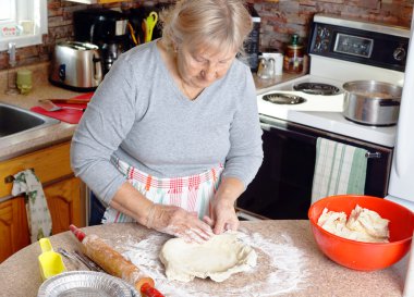 Grandmother making pies clipart