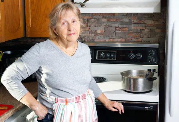 Friendly grandmother cooking — Stock Photo, Image