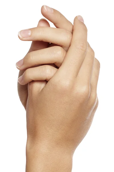 Close-up de mãos de mulher com manicure sobre um fundo branco — Fotografia de Stock