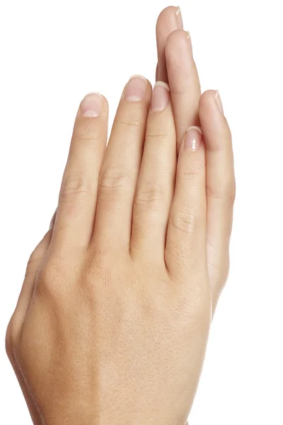 Крупный план женских рук с маникюром на белом фоне — стоковое фото