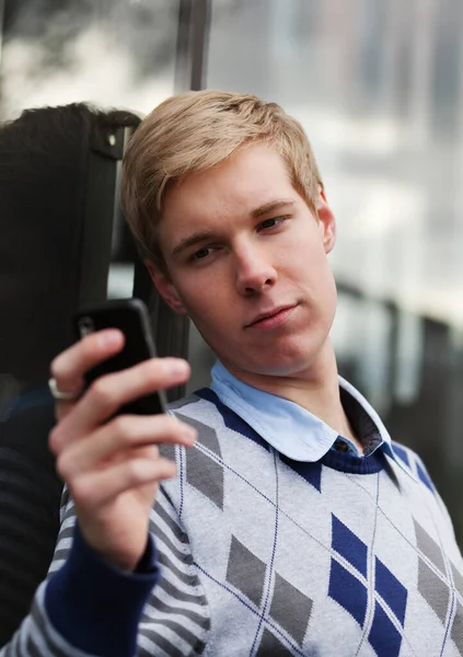 Young Blonf Handsome Boy Checking Pictures His Cameraphone Royalty Free Stock Images