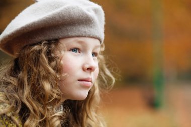 girl in grey beret in park